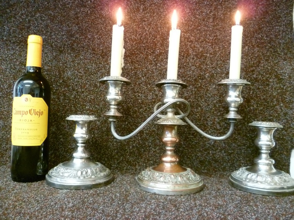 THREE VICTORIAN SILVER ON COPPER CANDLESTICKS, TWO STICKS AND ONE CANDELABRA