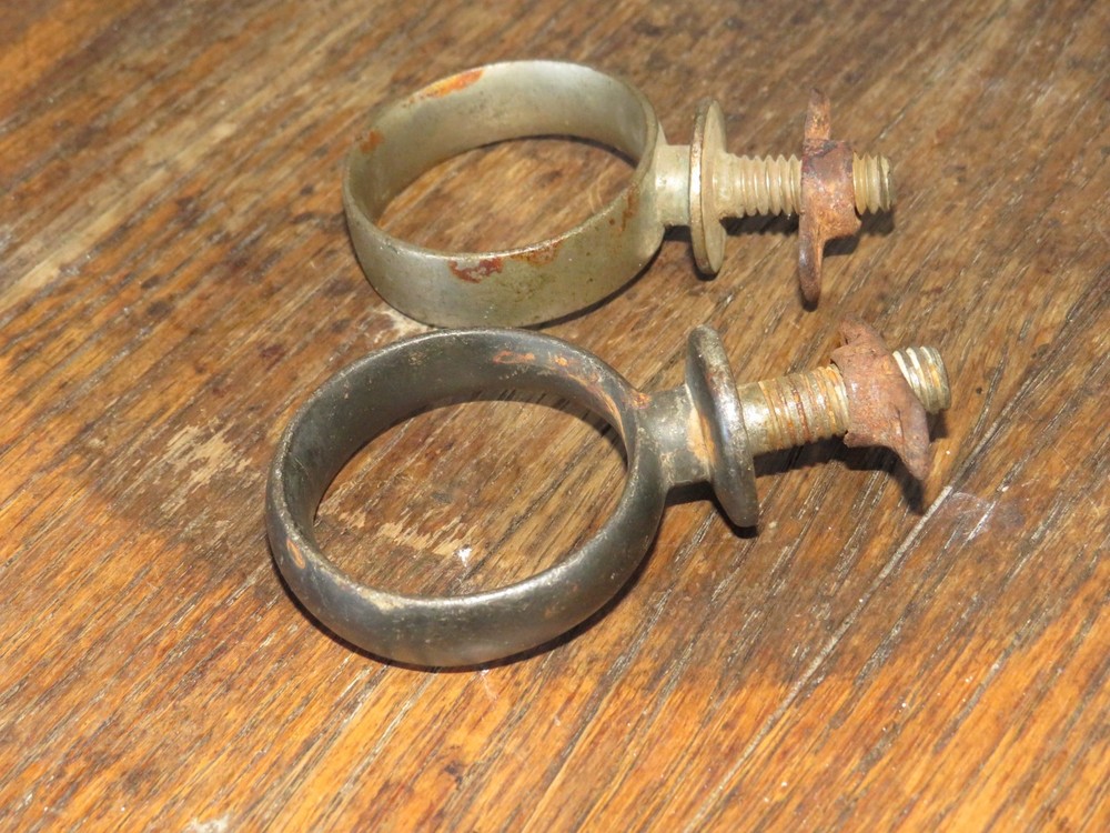 Two Antique Primitive Metal Ring Band Pipe Brackets