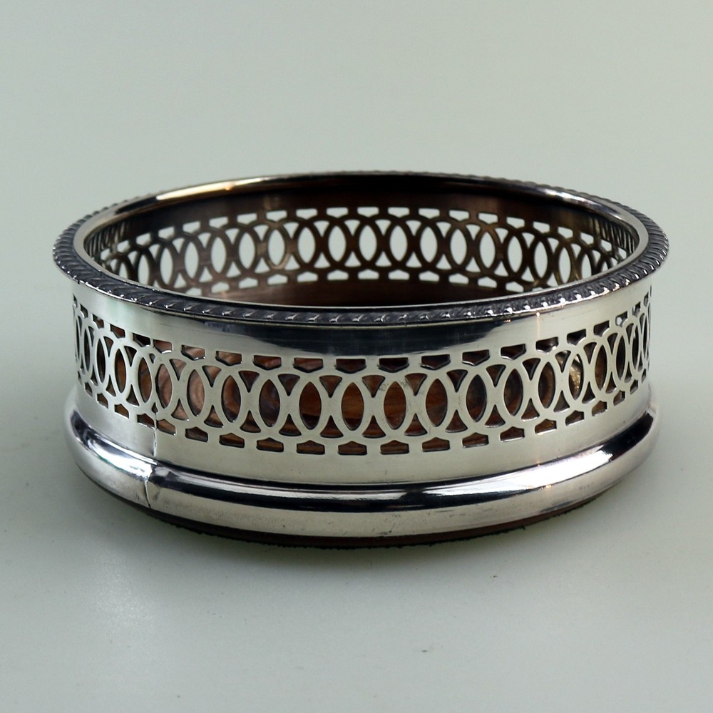 An antique silver plated on copper pierced Decanter Stand Coaster C.20thC