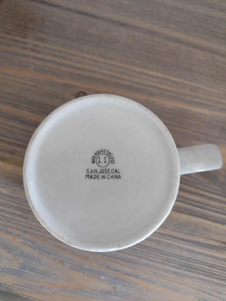 VINTAGE OFF DUTY SANTA MUG
