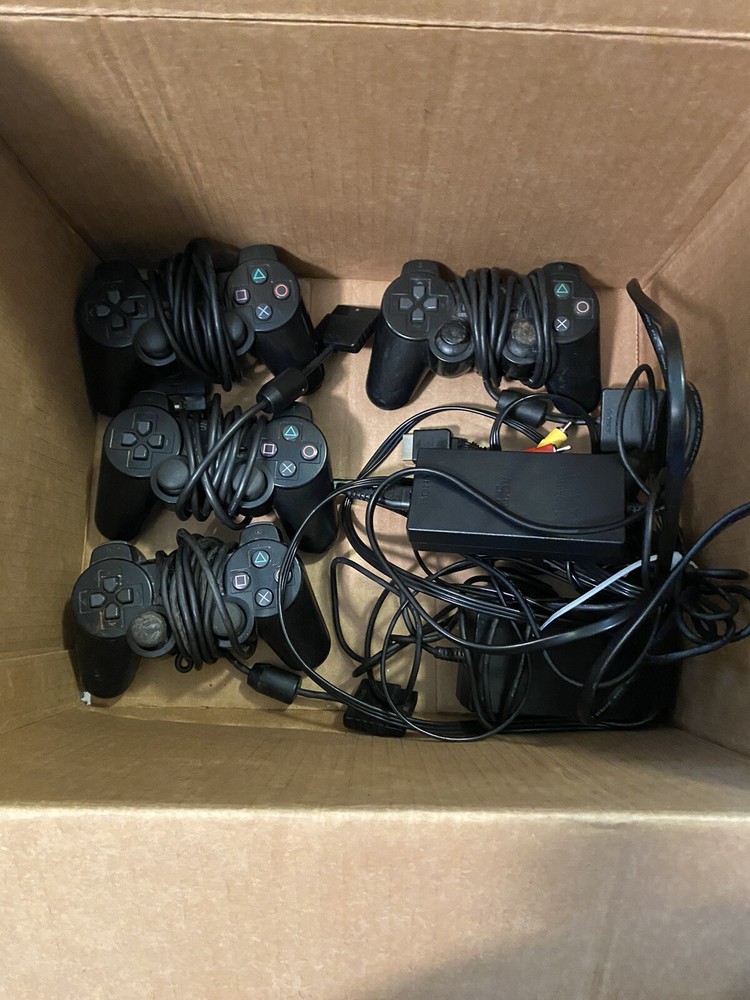 2 Ps2 Slims (one does Not Read Disc) + 4 Controllers + Memory Card+ 15 Games