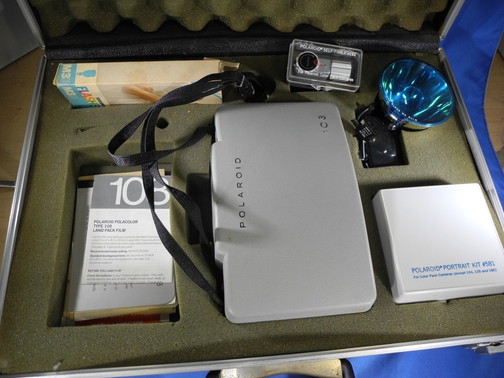 Polaroid automatic 103 land camera w/ flash & many accessories & New Battery!