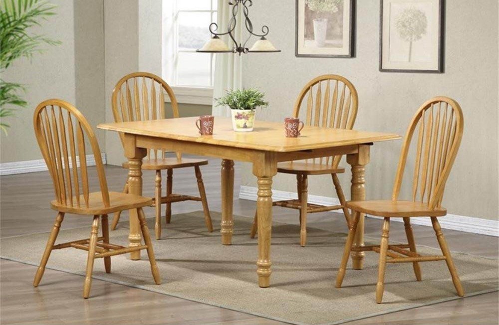 Solid Oak dining room table  60”x35” and 4 chairs