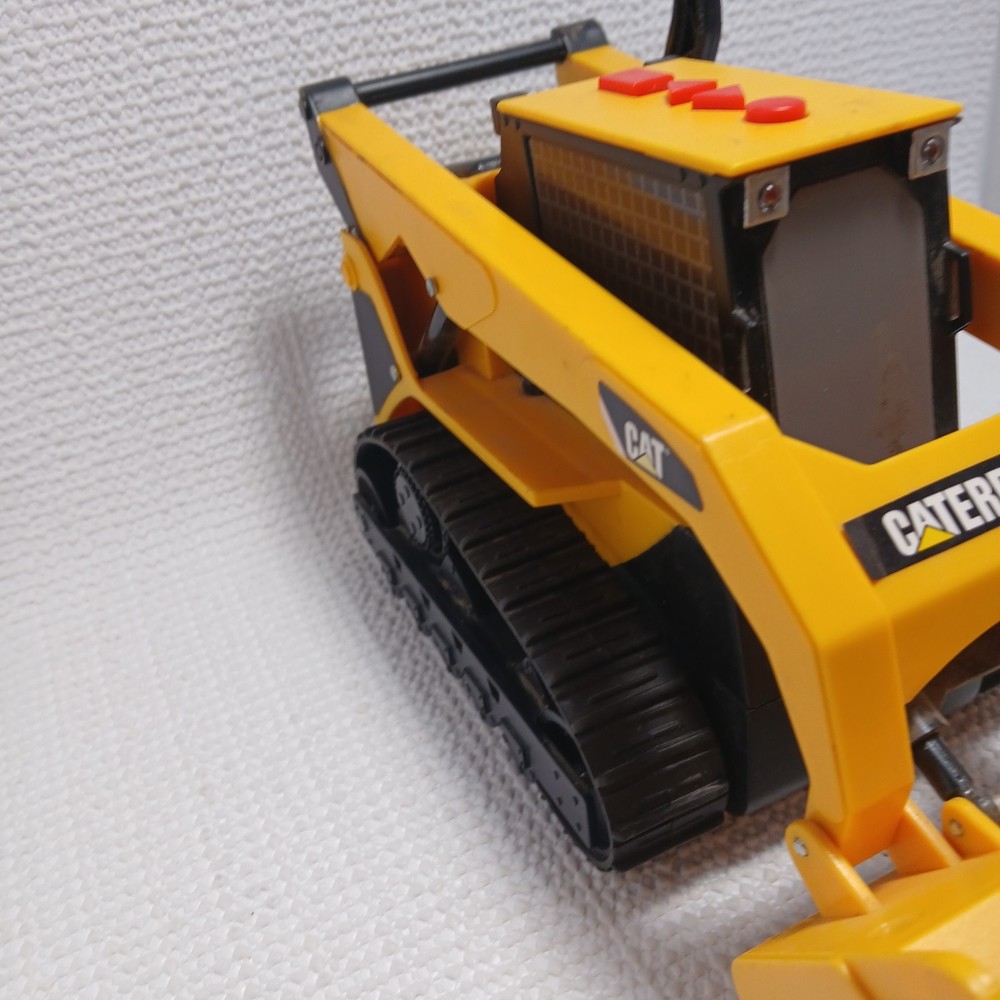 Caterpillar (CAT) toy skid steer loader, likely a "Big Builder". UNTESTED