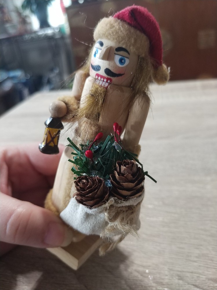 Handcrafted, painted wood Christmas nutcracker ornament