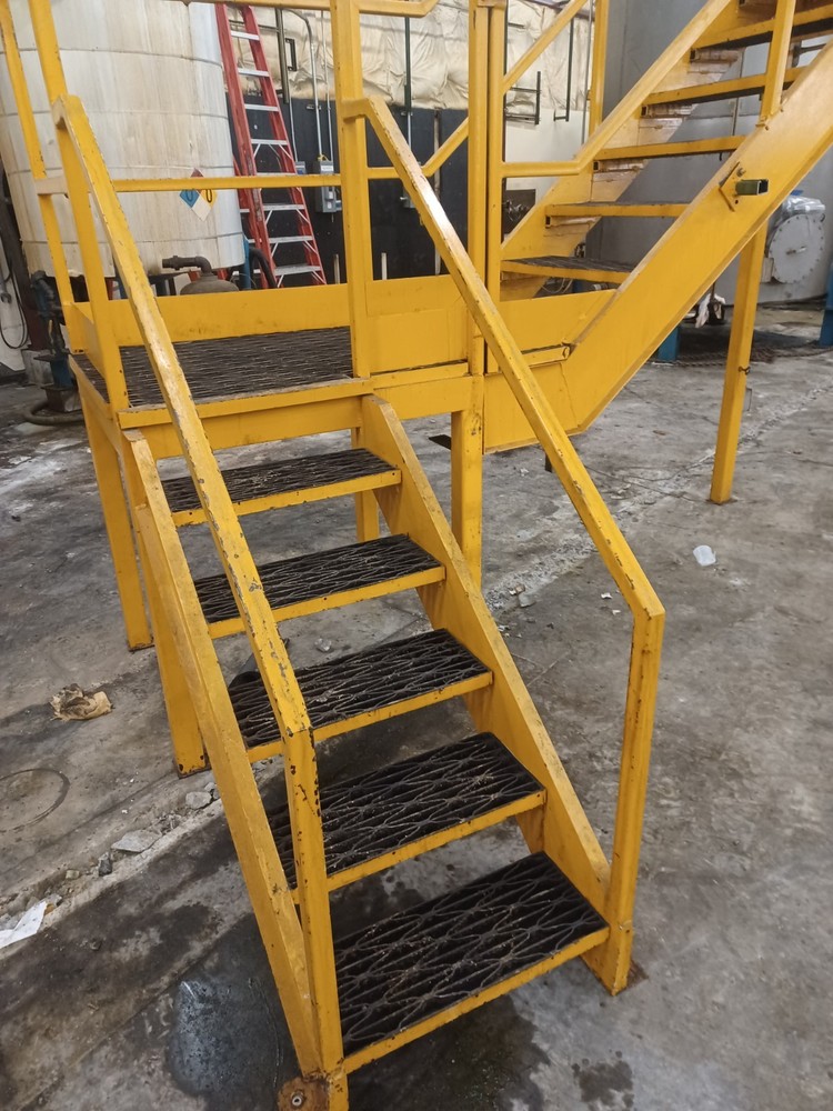 STEEL CONSTRUCTED MEZZANINE | COLOR: YELLOW | MULTI-LEVEL | MODULAR CONSTRUCTION