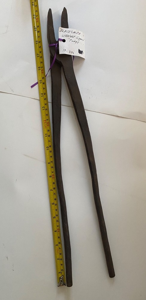 Collection of vintage blacksmithing and farrier tools