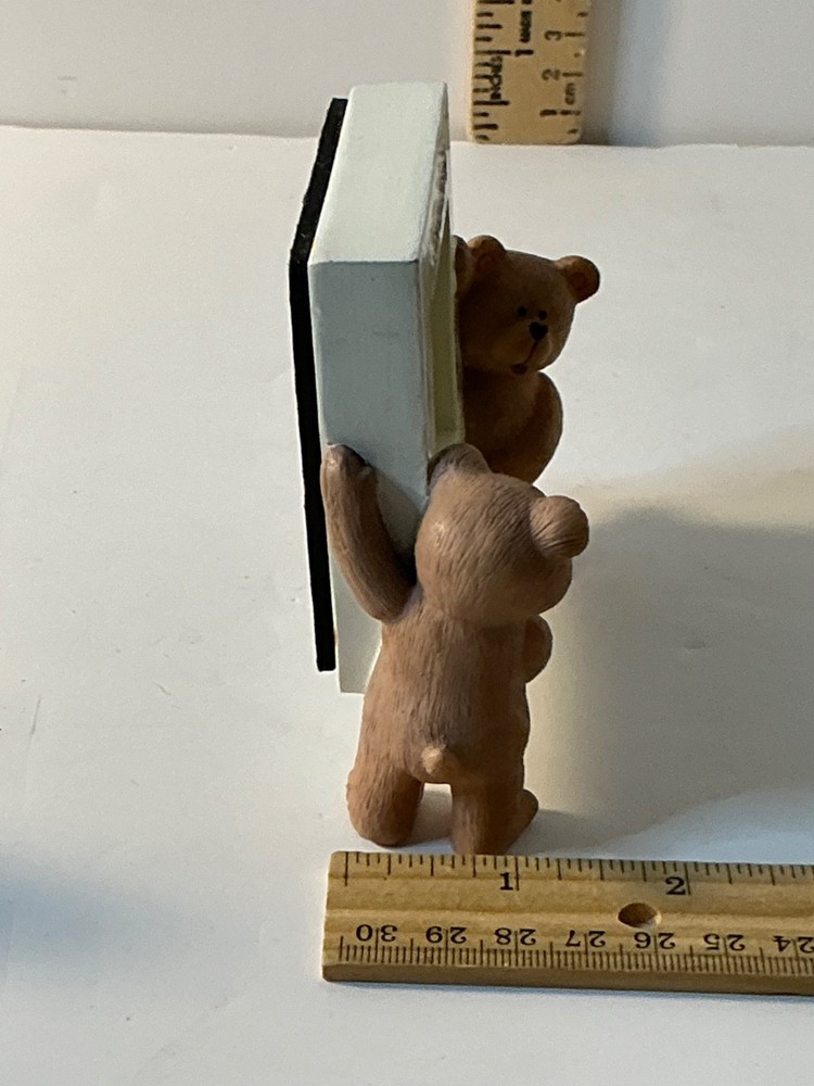 Two bears holding a picture frame "Someone special"