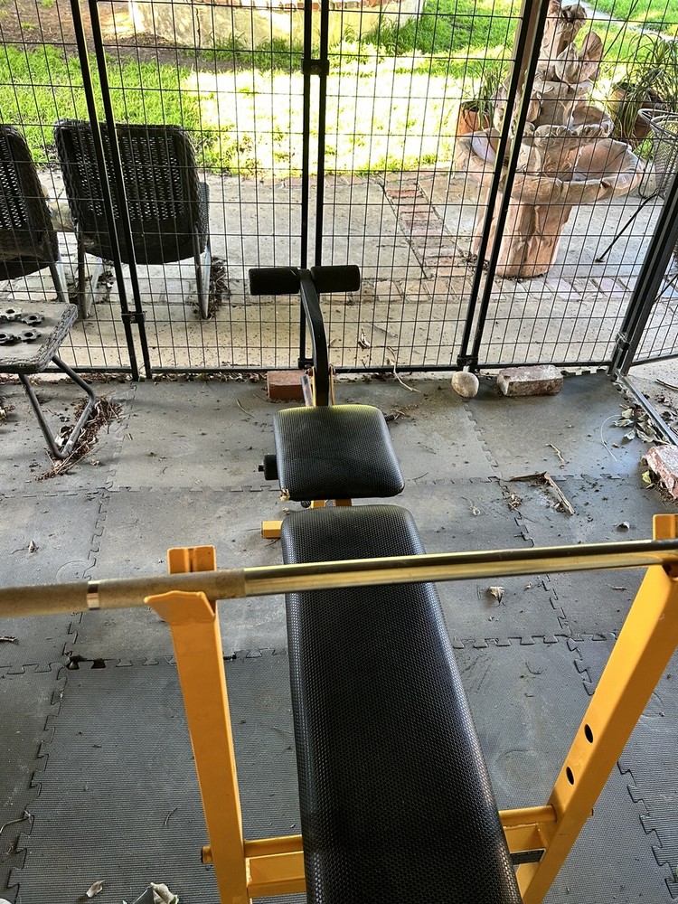 bench press with weights. Needs A Little Wipe Down But That Is About It.