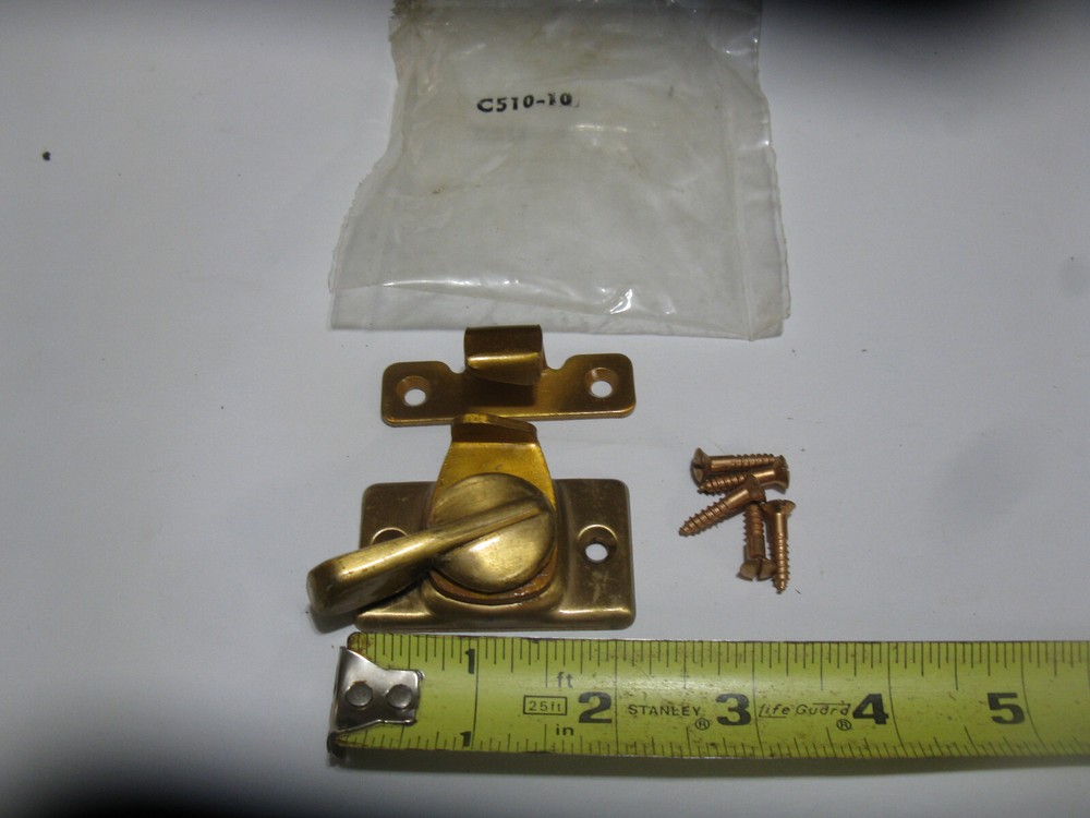 National Hardware Sash Lock in brass finish