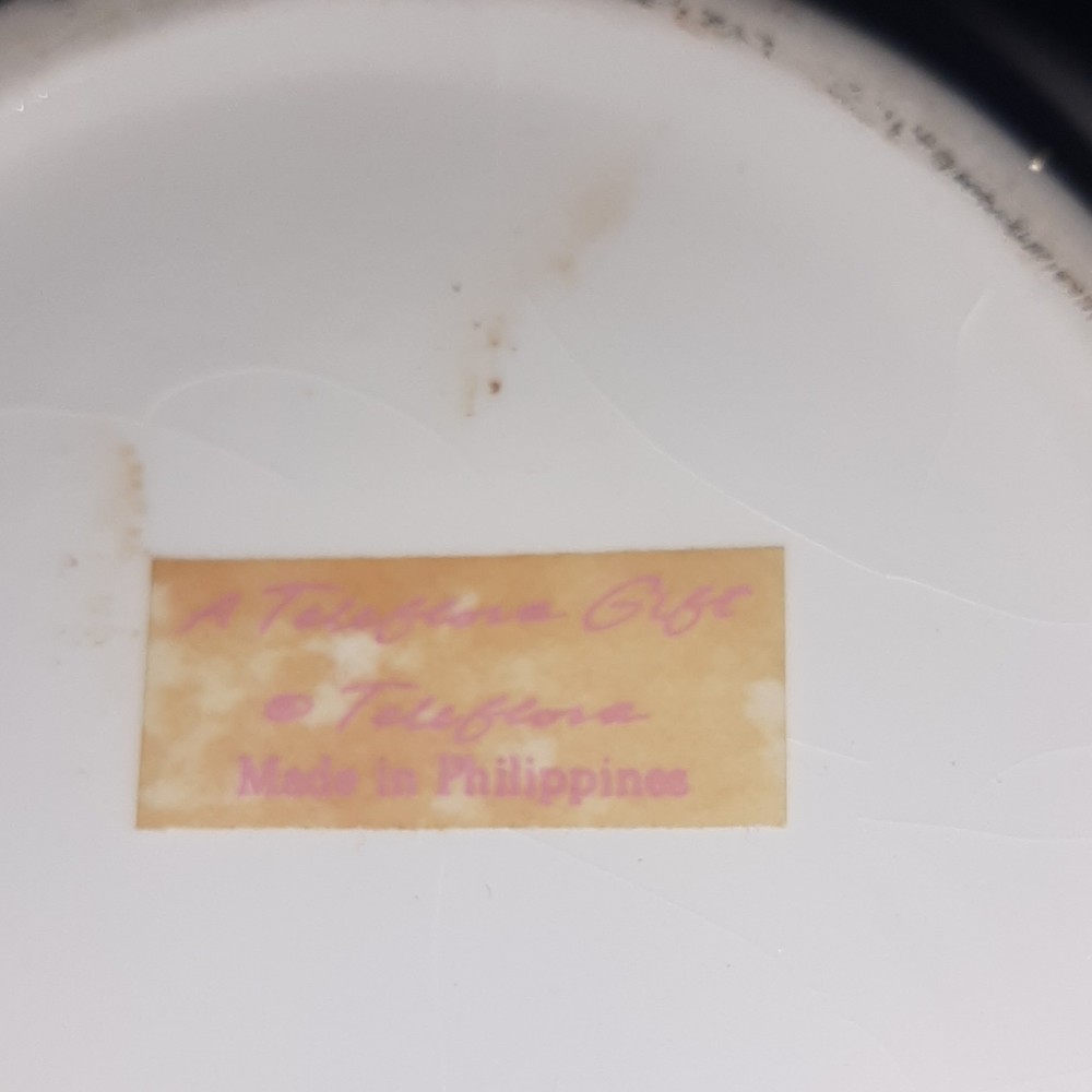 A Philippine Ivory Floral Ceramic Teapot with Lid