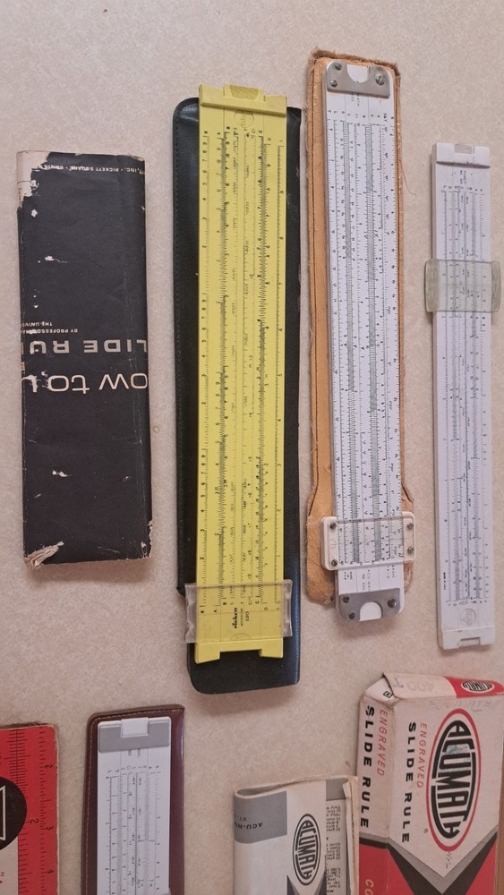 5 vintage slide rules. PICKETT AND ACUMATH