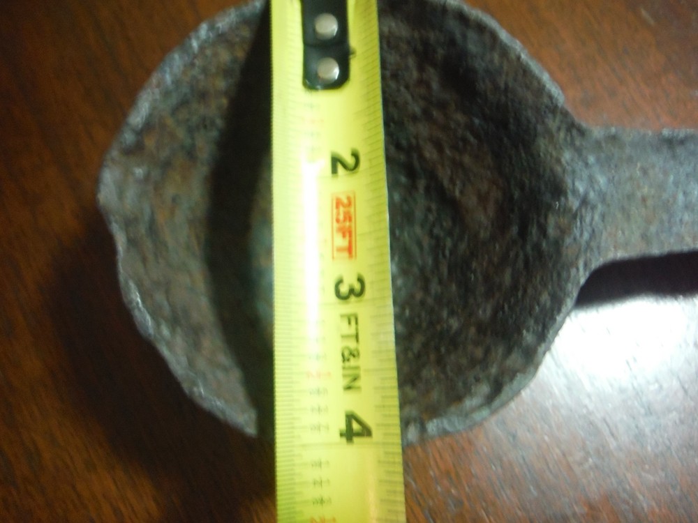 vintage huge metal spoon