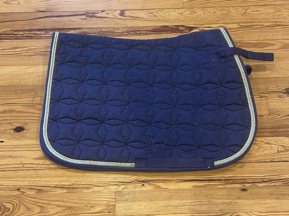 navy blue saddle pad with yellow/blue edging