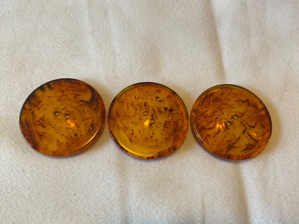 THREE TRANSLUCENT AMBER COLOR BUTTONS 1. 5/16”
