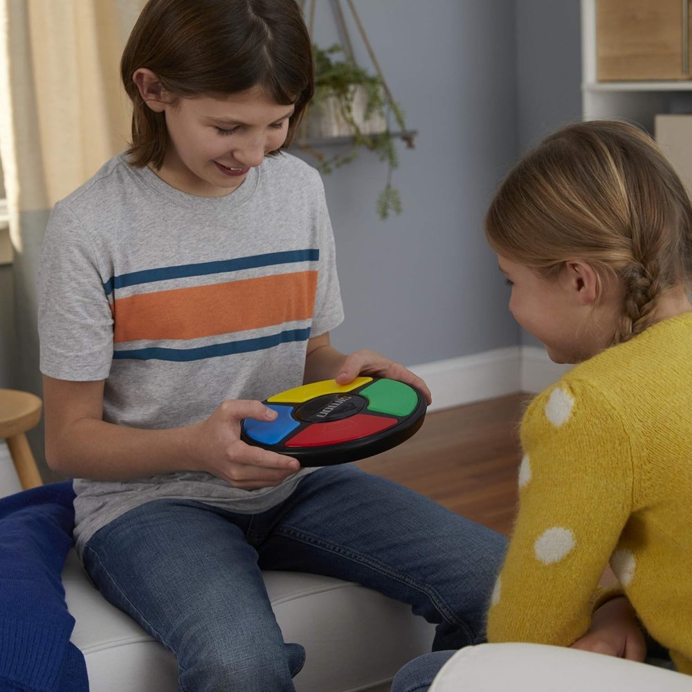 Hasbro Gaming Simon Handheld Electronic Memory Game With Lights and Sounds...