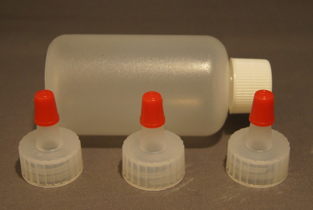 THREE PLASTIC SQUEEZE BOTTLES