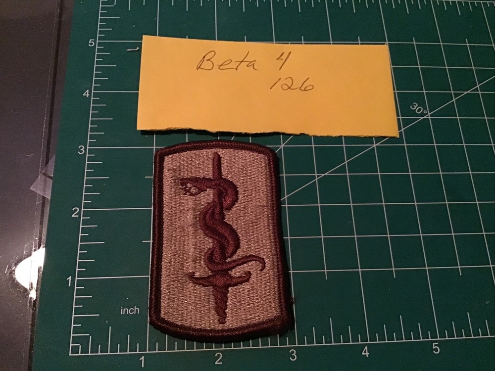 Army Patch: 30th Medical Brigade - tan, merrowed edge