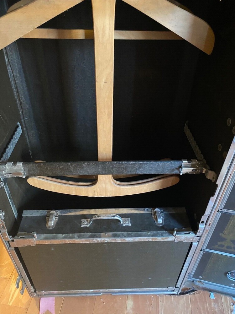 Immaculate early 1900 Hartman upright steamer trunk/cushion top.
