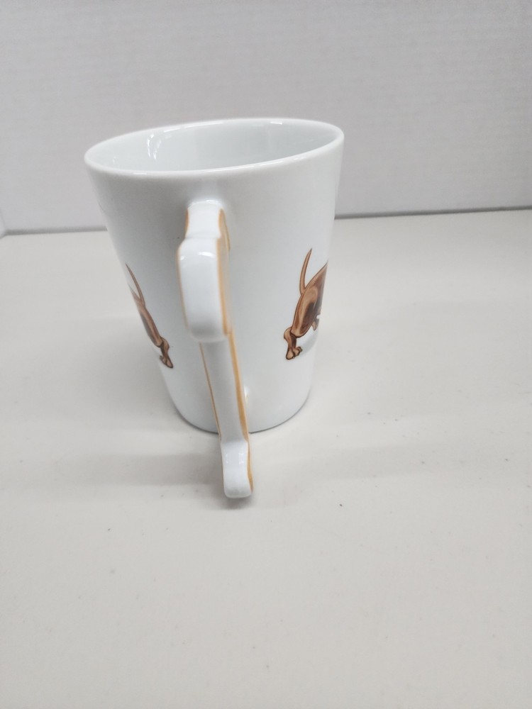 white ceramic mug featuring a brown dachshund design with a distinctive dog