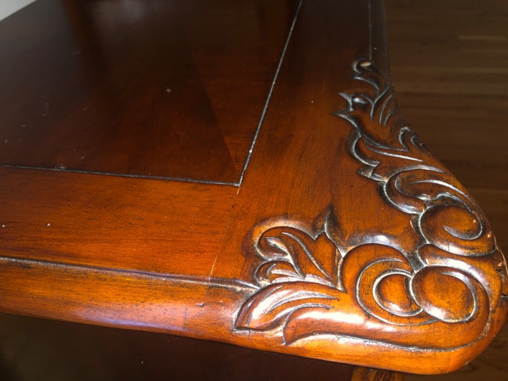 Brown dresser with adjustable three panel mirror.