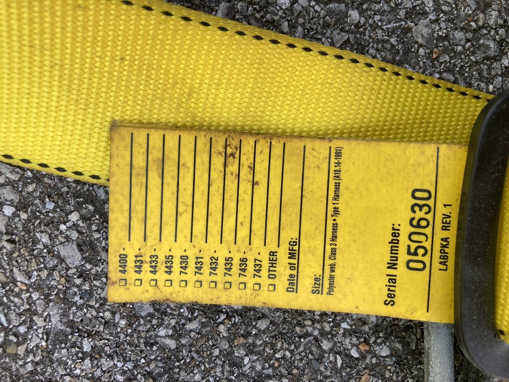 safety harness with strap attached