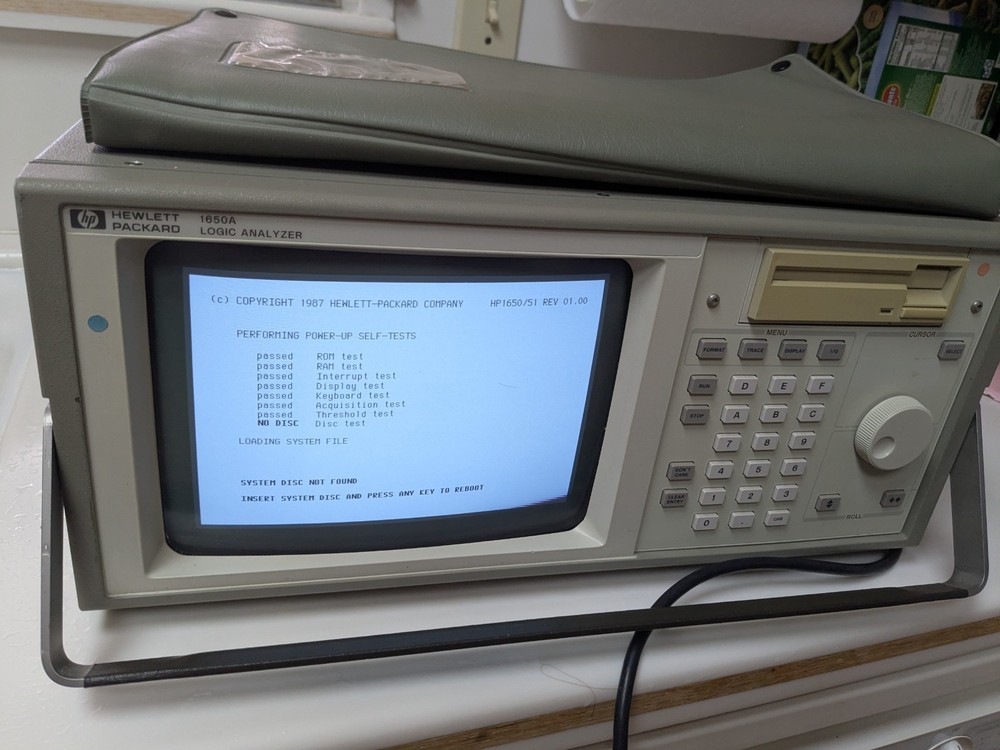HP1650A Logic Analyzer Hewlett Packard Powers up incld Operating disk+manual DVD