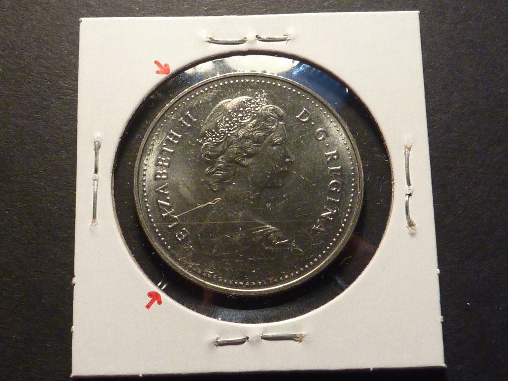 Error: Canada 1982 BU Voyageur nickel $1 with strike-through errors both sides