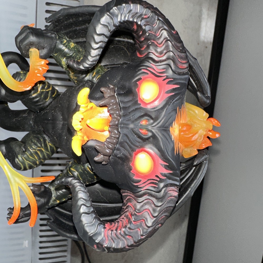 bobblehead demon with fire rope