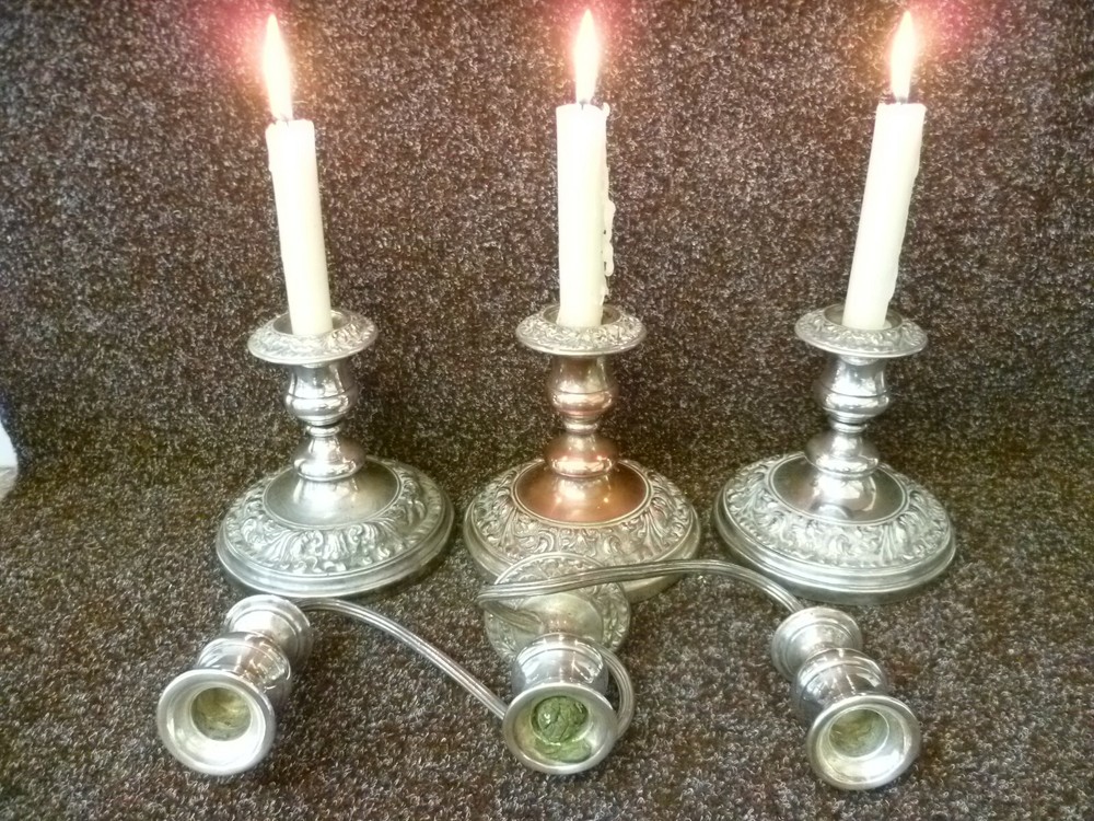 THREE VICTORIAN SILVER ON COPPER CANDLESTICKS, TWO STICKS AND ONE CANDELABRA