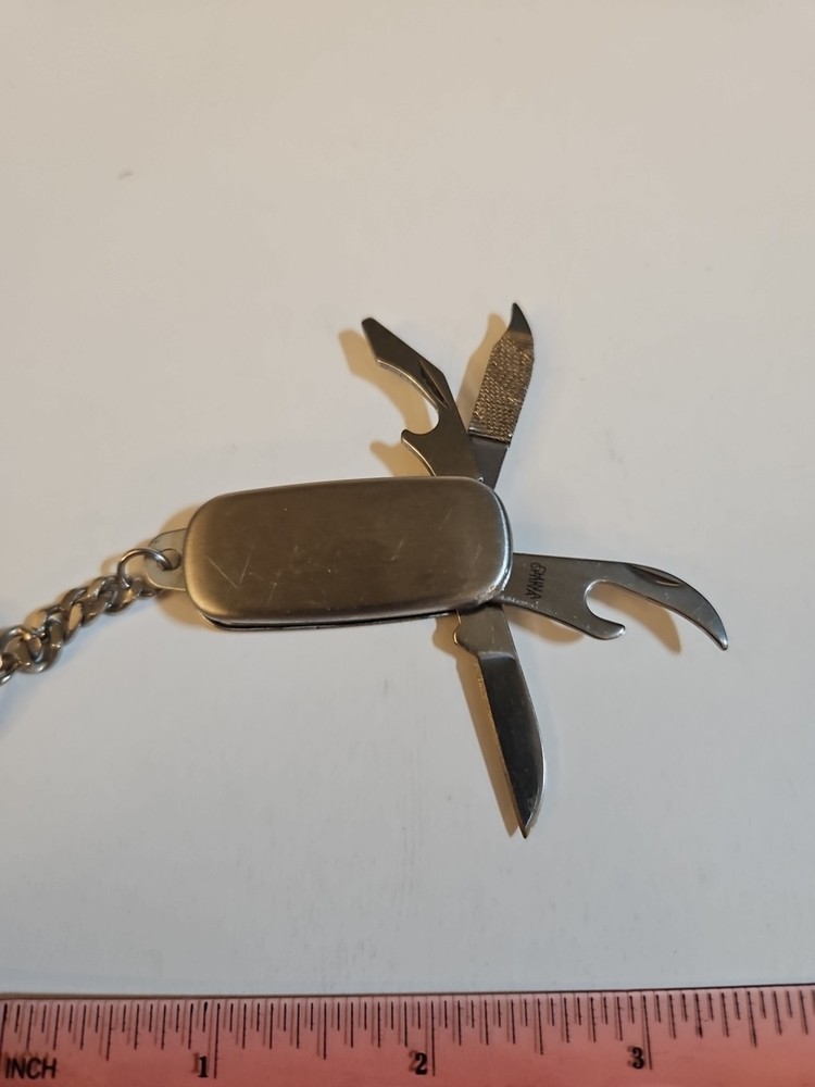 multi tool key chain stainless steel With P&G engineering On It.