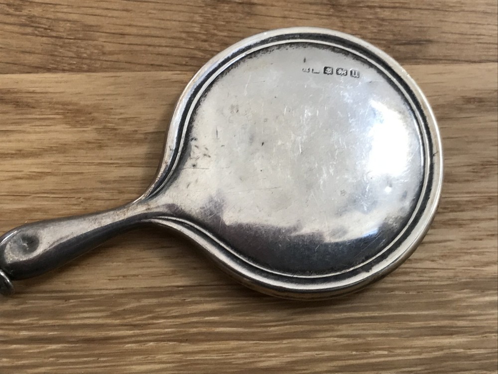 nice looking small size solid silver vanity mirror