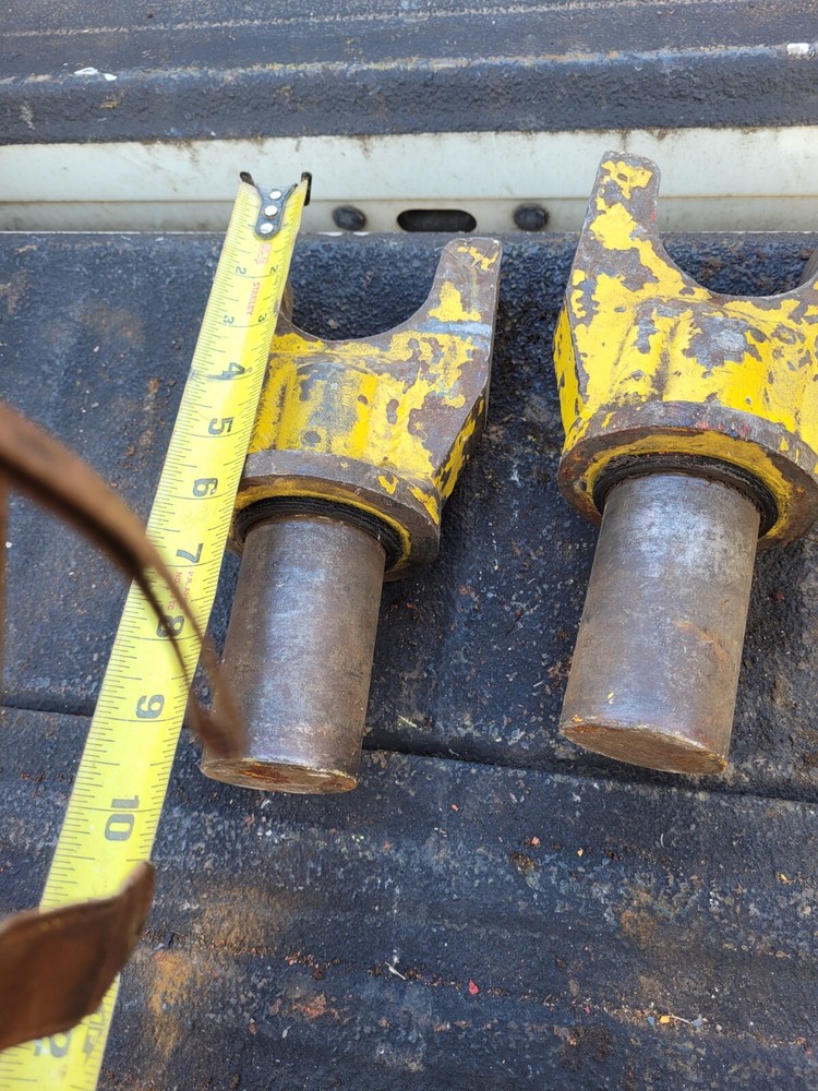 Two Yellow Locking Heavy Equipment Pins Inserts