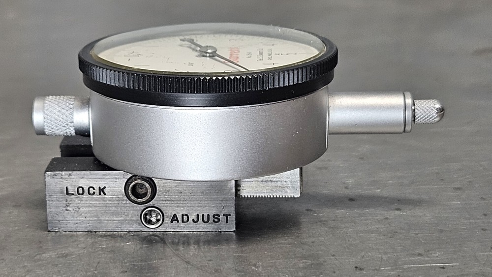 Starrett No. 25-111 dial indicator with No. 674-2 adjustable mounting bracket
