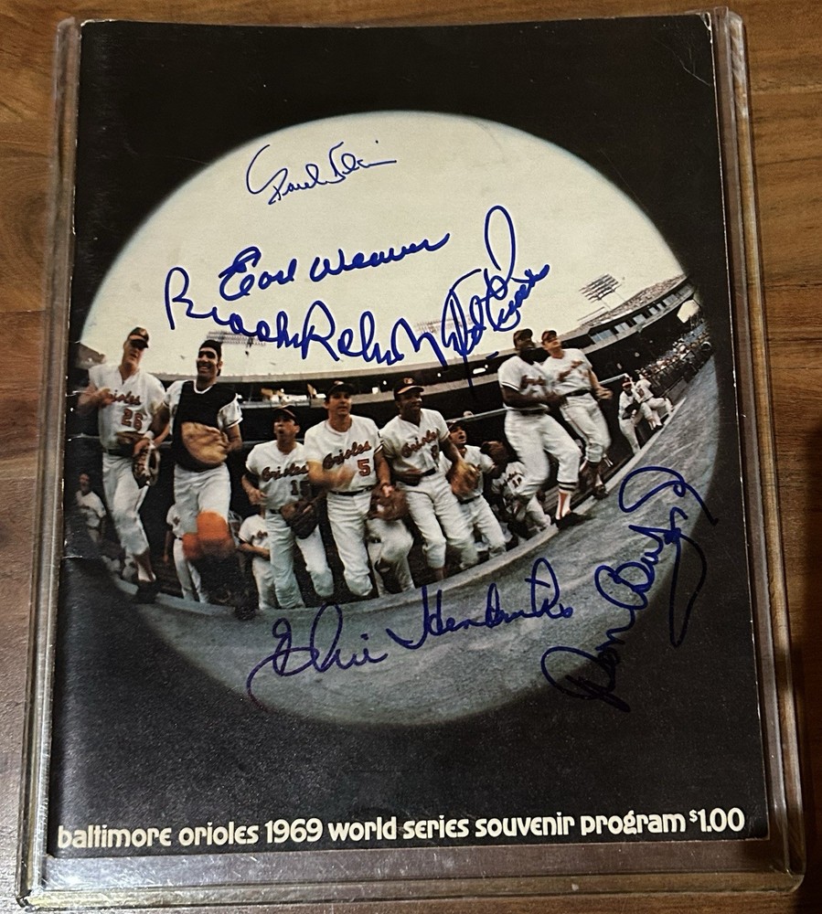1969 World Series program Orioles Version, Signed By 6: Weaver Robinson Baylor