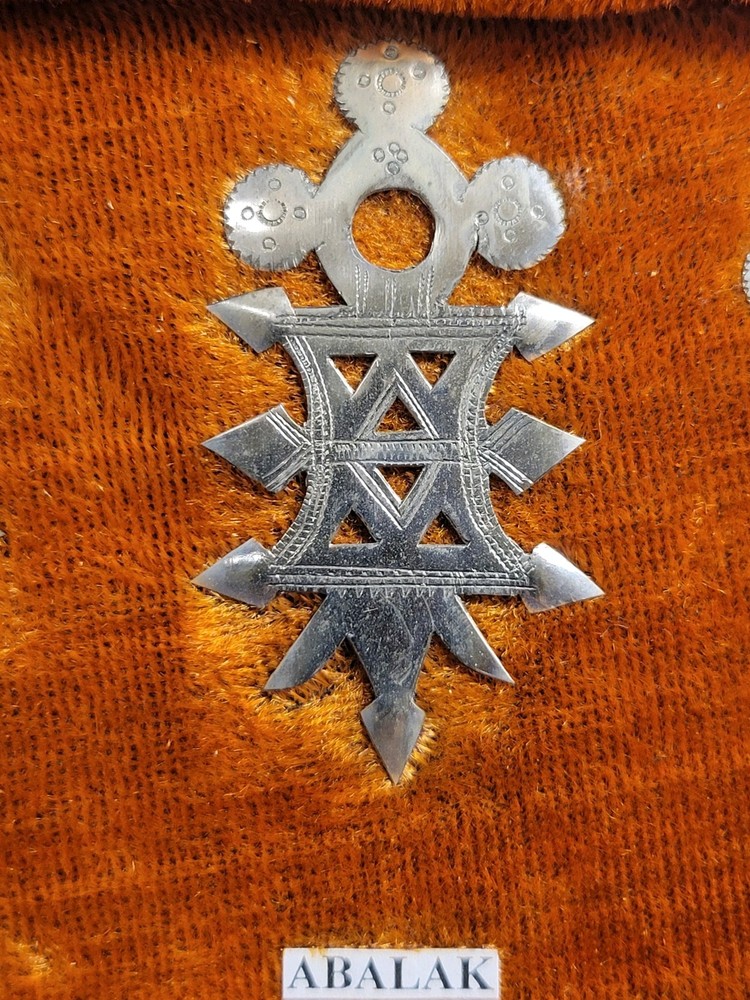 Collection of Hand-tooled Tin Badges