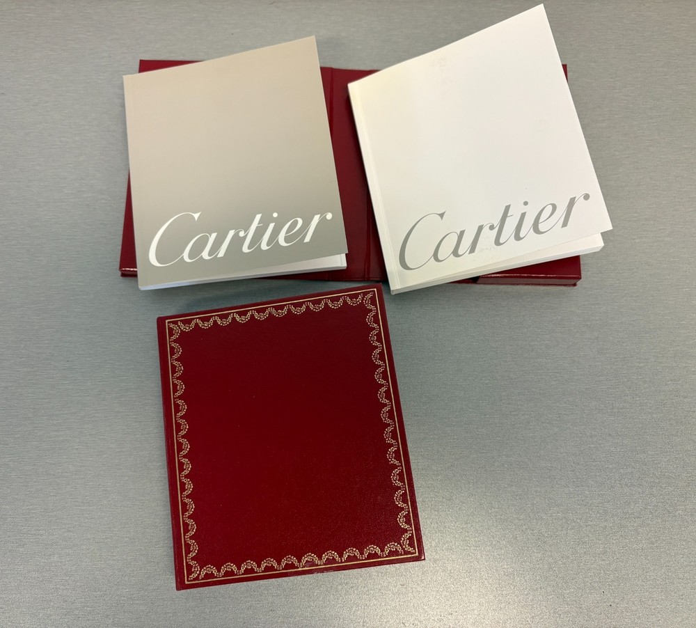 Two Cartier Original Certificate & Instruction Booklet's