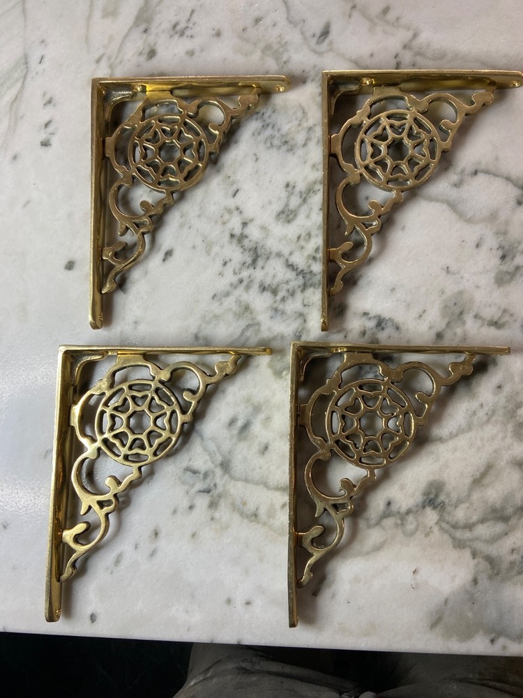 Vintage brass shelf brackets; four