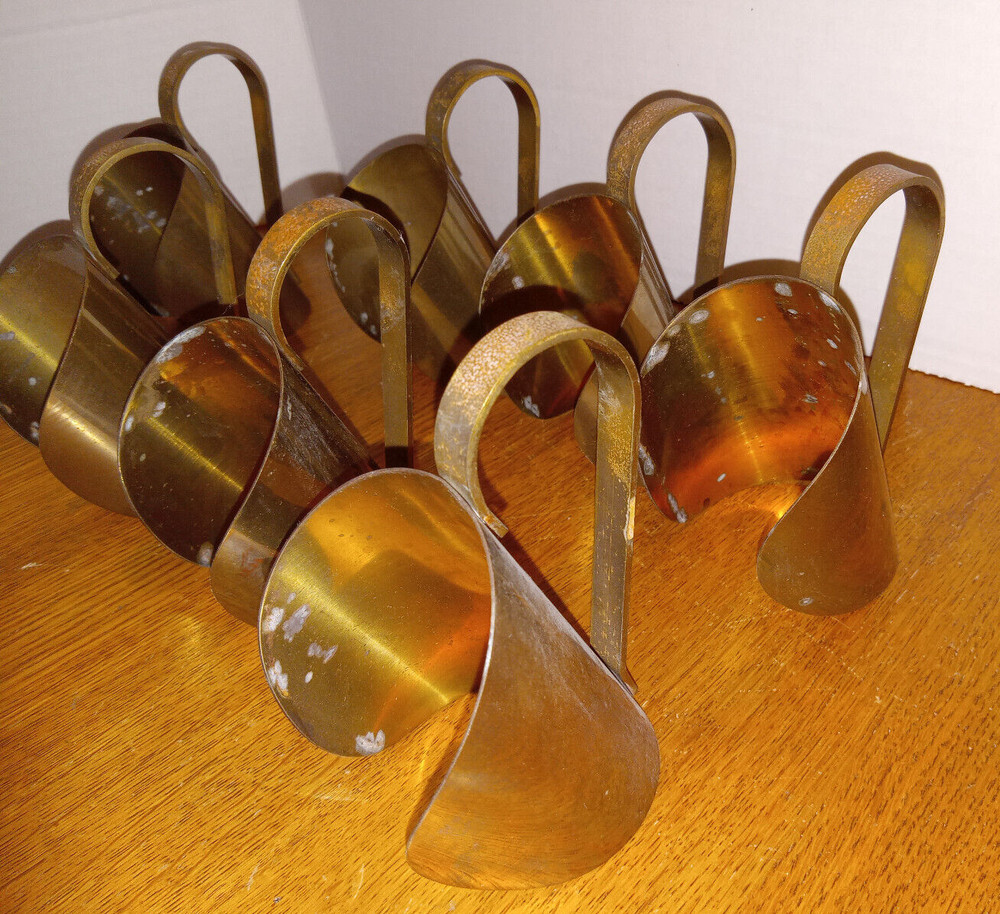 SET OF 7 BRASS BOTTLE CANDLE HOLDERS / HANDLES ?