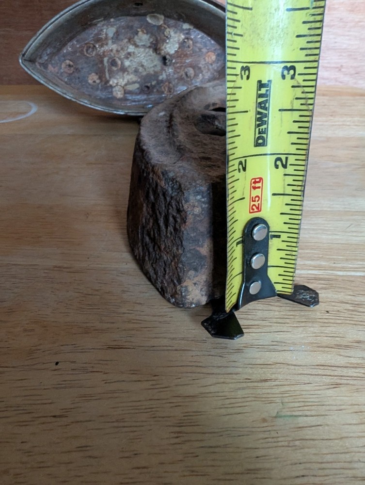 vintage cast iron sad iron featuring a removable wooden handle