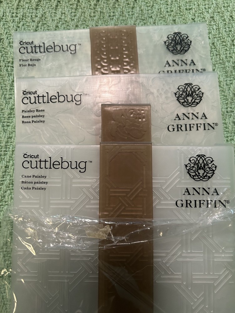 Anna Griffin Embossing Box + 2 sets from Cuttlebug. 50 embossers can fit.