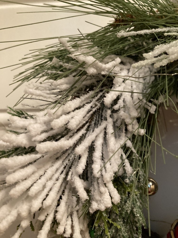 The Nutcracker Wreath With A Red And Green Ribbon