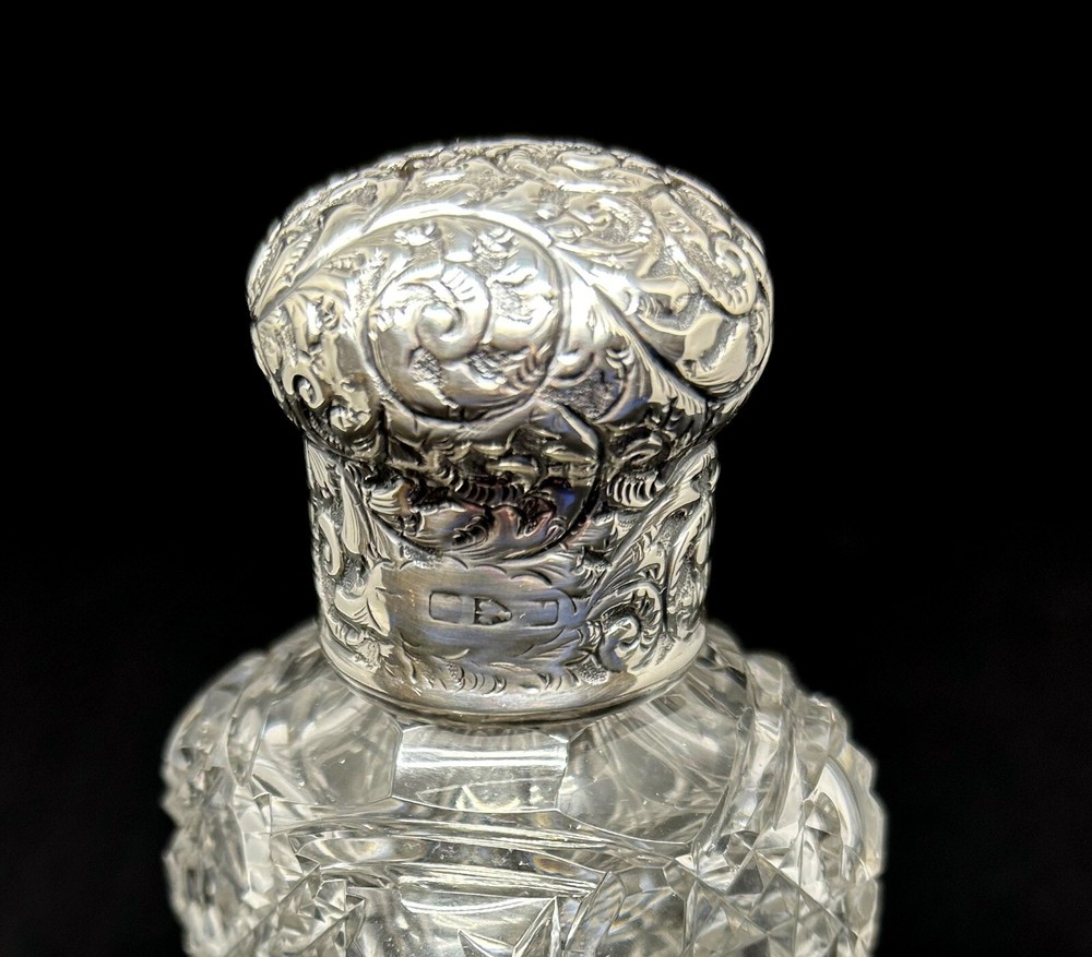 Edwardian sterling silver topped perfume bottle