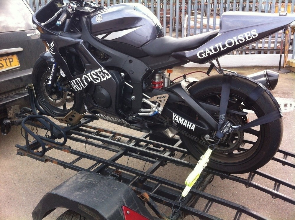 Rear wheel tie-down strap