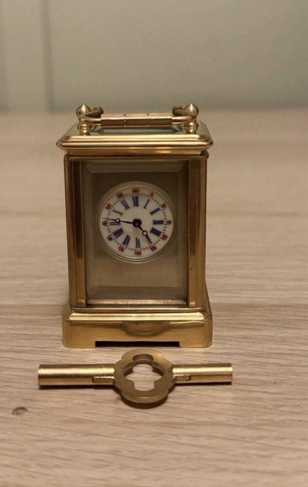 Bronze miniature carriage clock with a silver plated front