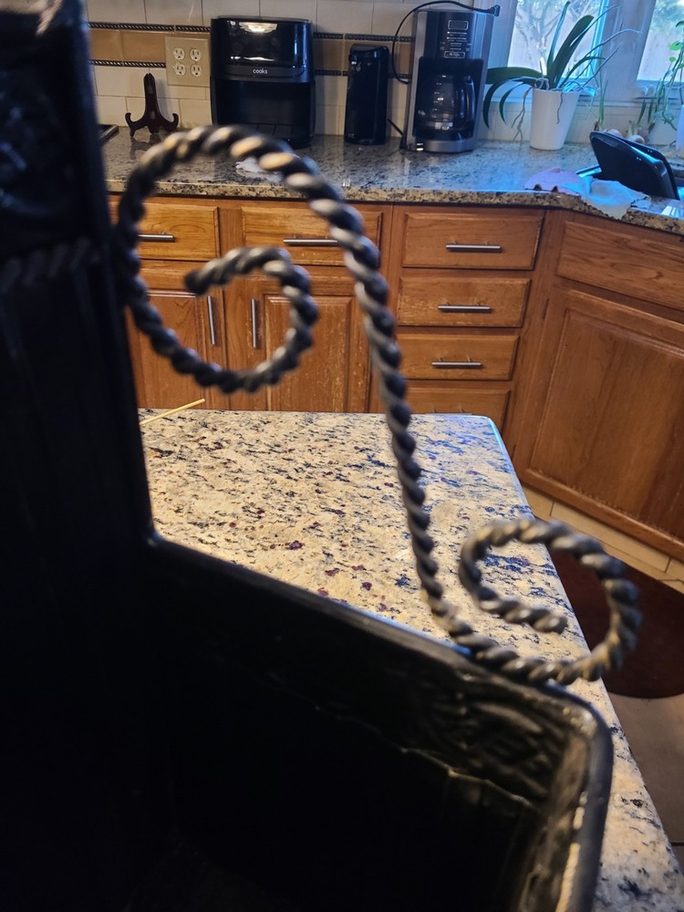 antique cast iron fireplace log holder basket. It is a decorative piece