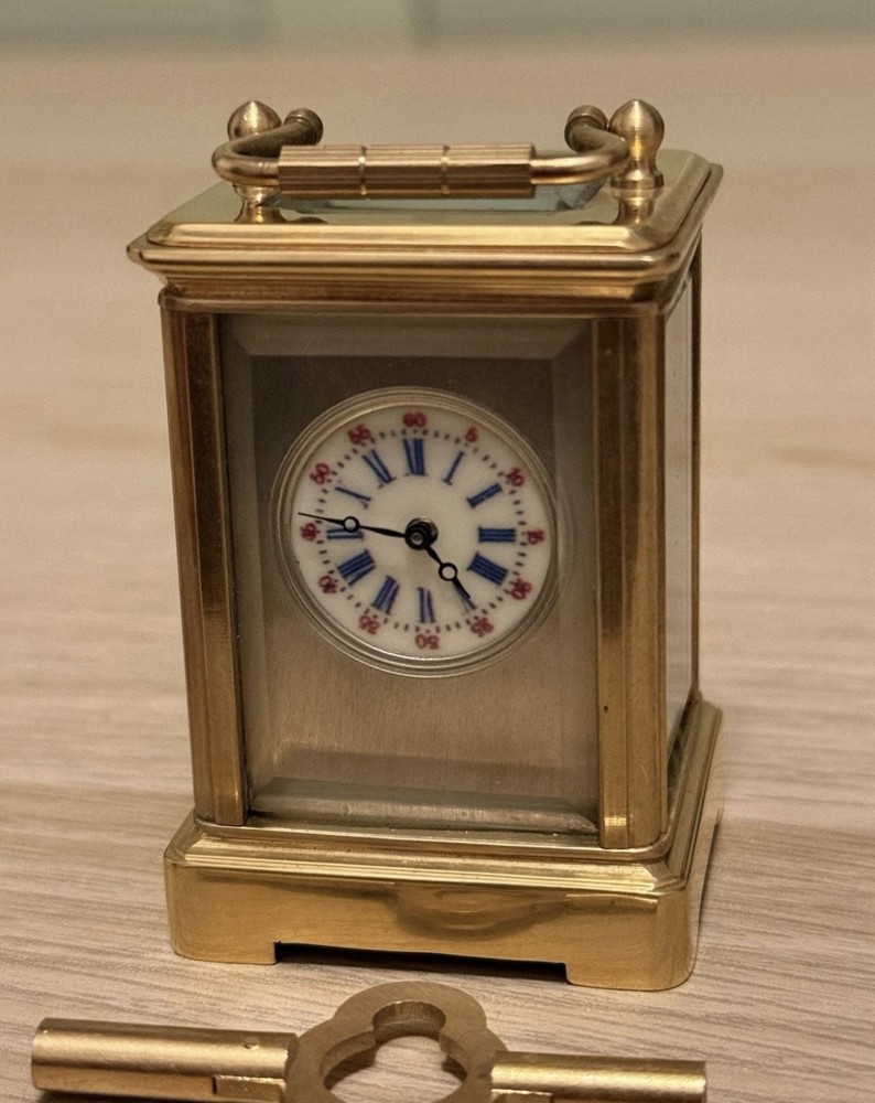 Bronze miniature carriage clock with a silver plated front