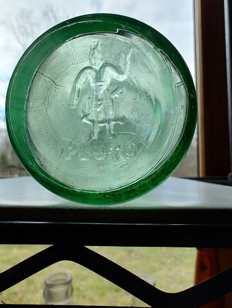 Vintage Pluto Water Bottle America’s Physic Devil Embossed Green