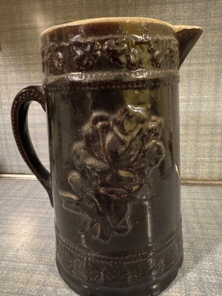 Antique Ceramic Pitcher with raised floral pattern