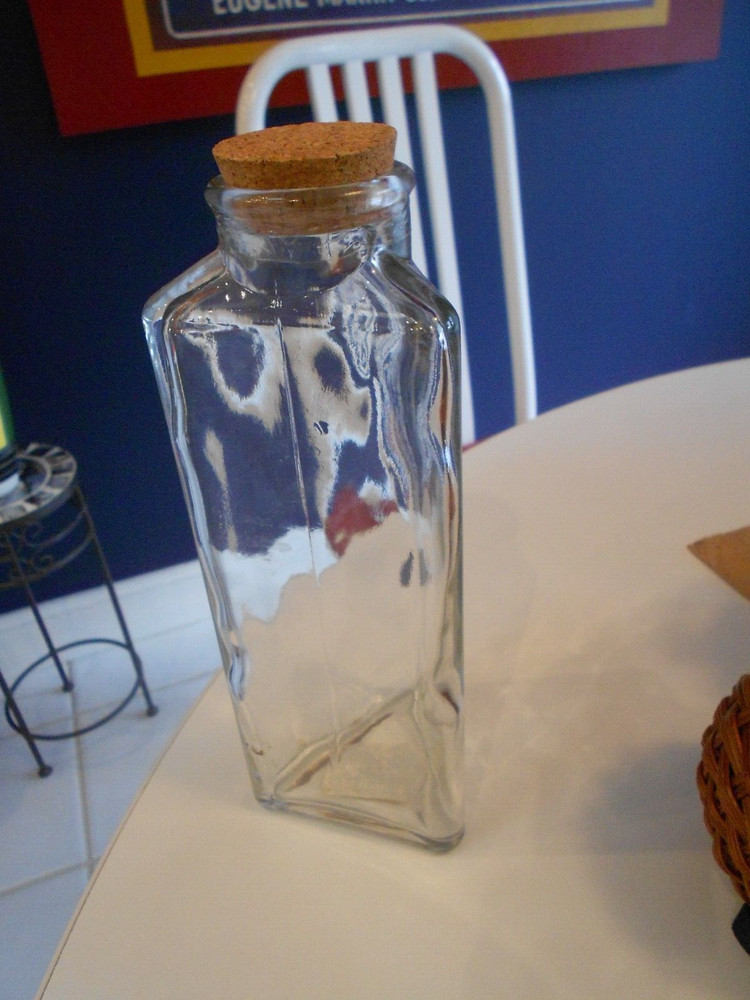 bottle with cork topper three flat sided 1999 issue 9 3/4" tall